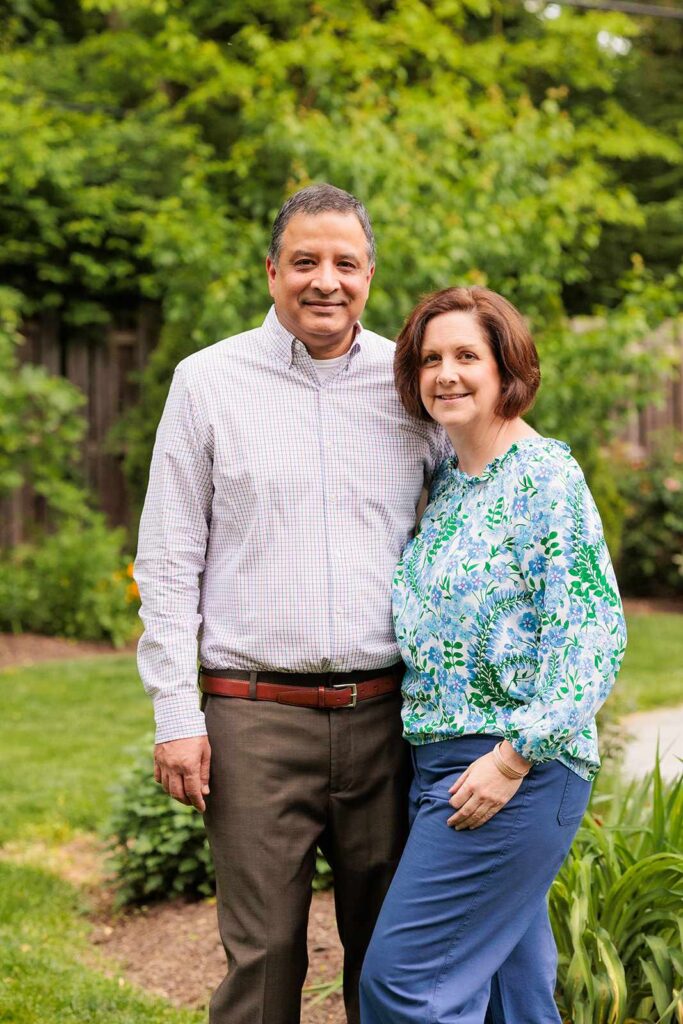 Couple poses in Lower Merion Garden during family photo session