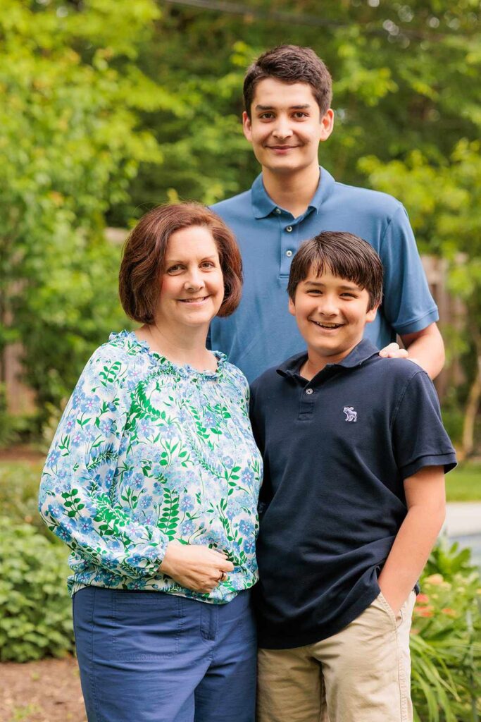 Mother and sons pose during family photo session in Lower Merion, PA